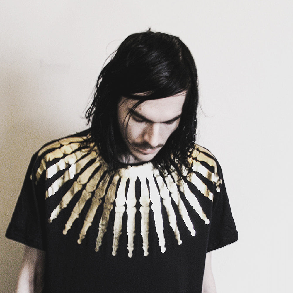 Golden Tribute: The Story of Jay Merrifield's Gold Bones T-Shirt Design